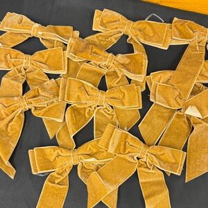 A Dozen Velvet Gold  Decoration Bows with twist tie attachment on back all new